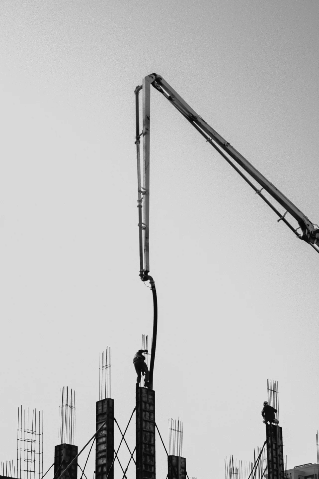 concrete pump and rebar on a tilt-up construction site in Gatineau