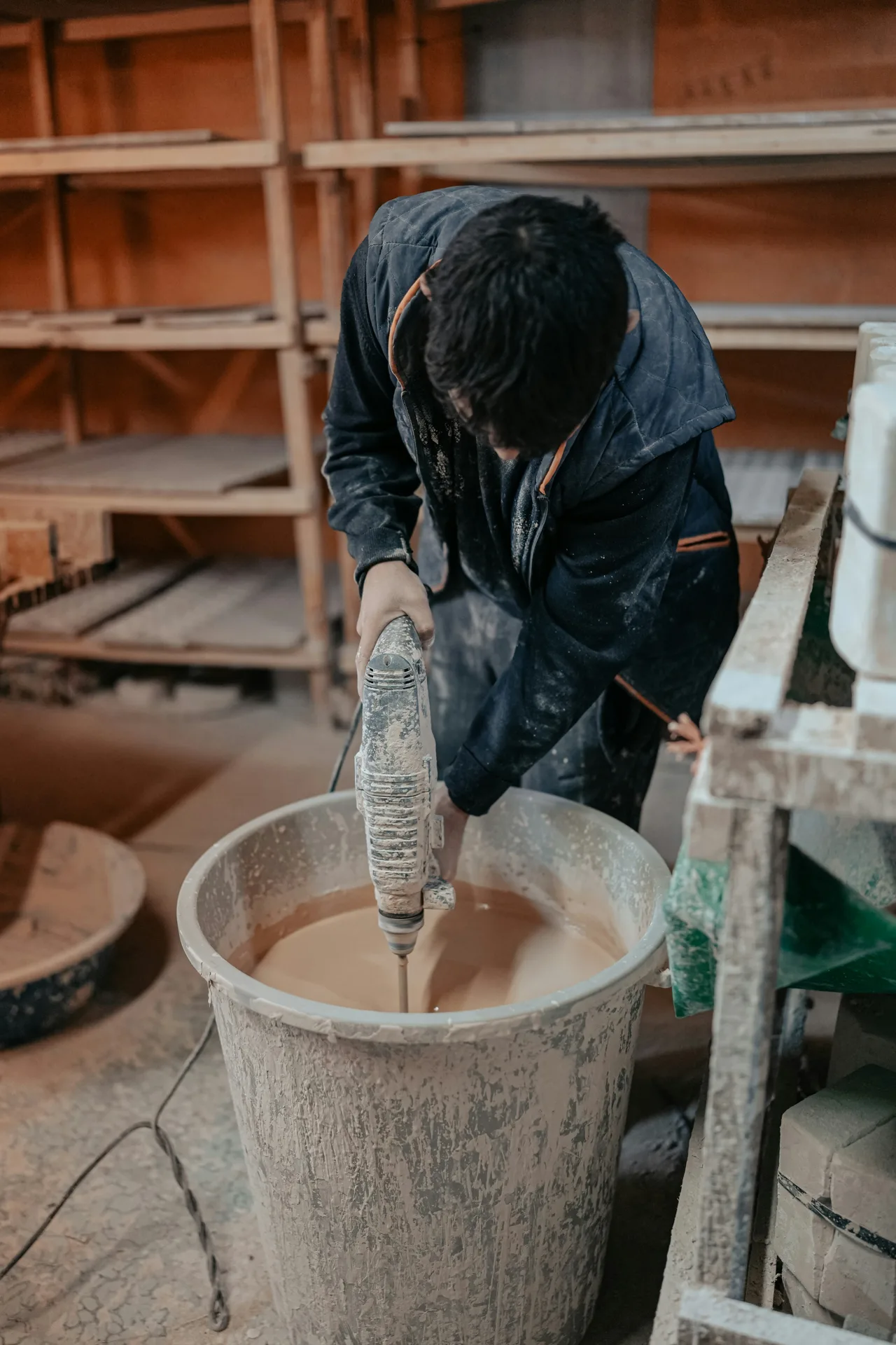 Quikrete bagged concrete being mixed in a paddle mixer on a Gatineau site