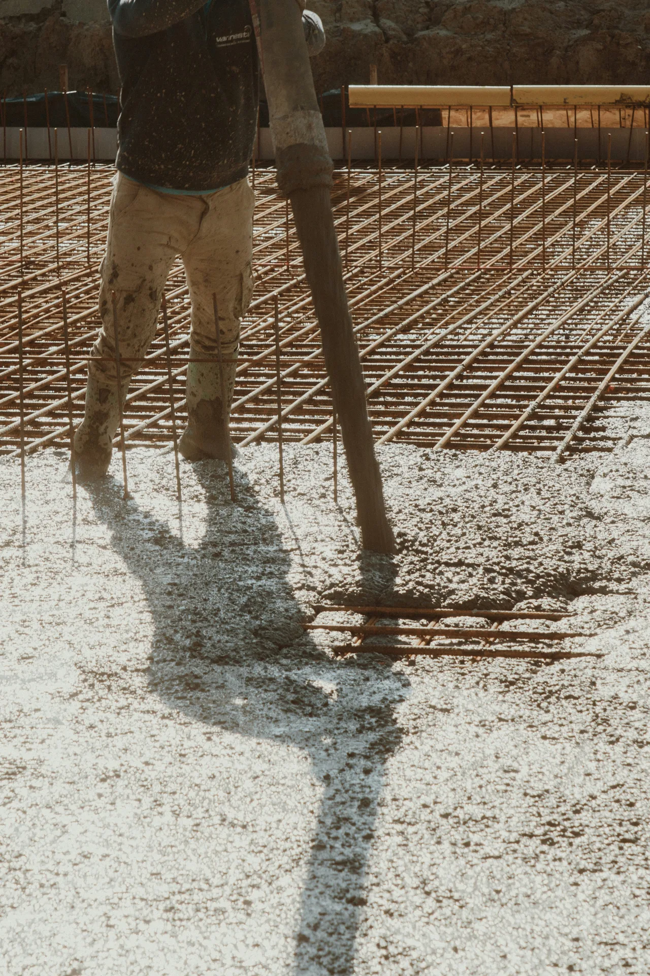 concrete pump hose placing concrete over a Gatineau rebar mat