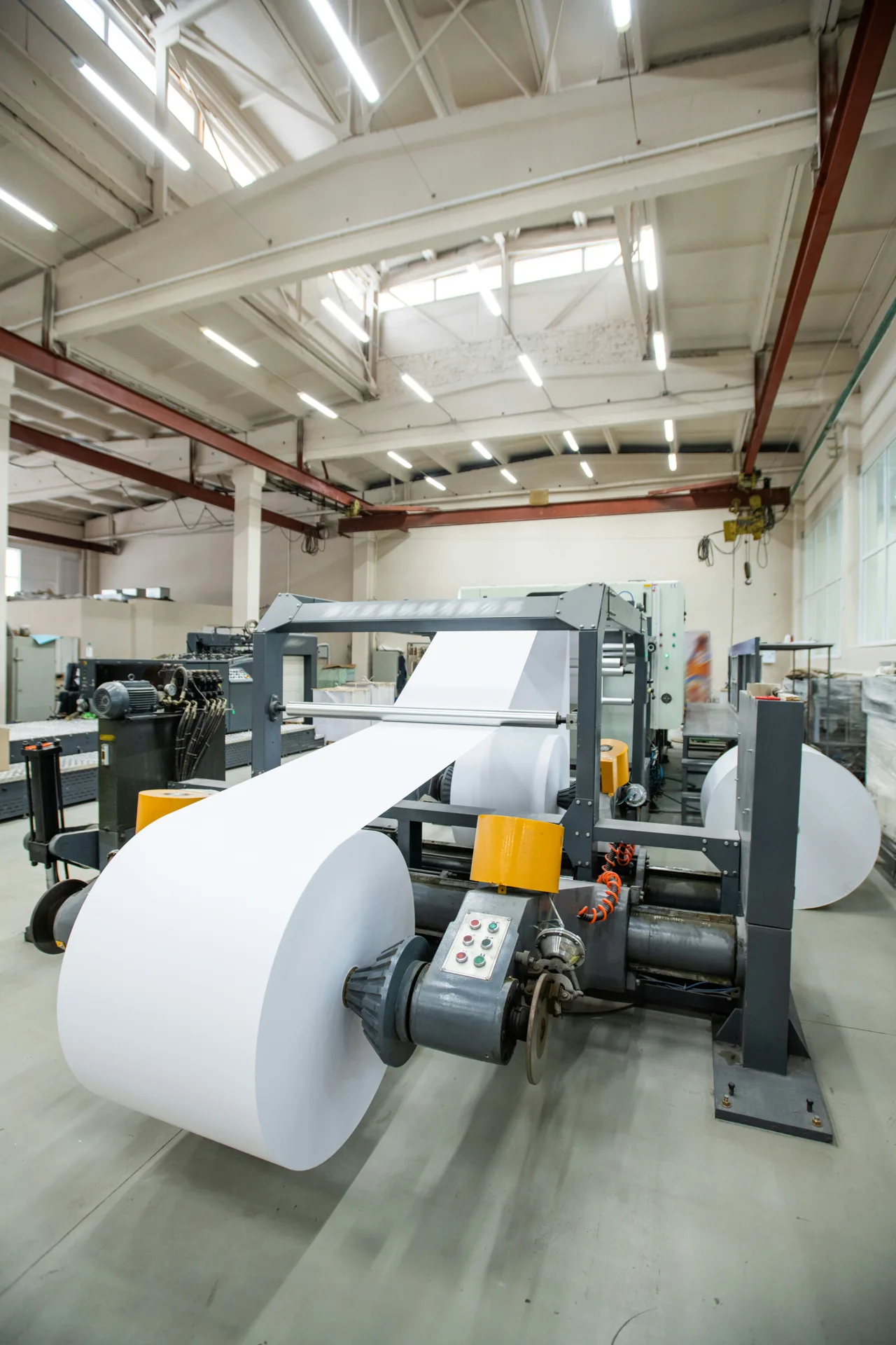 industrial concrete floor under a Gatineau printing press