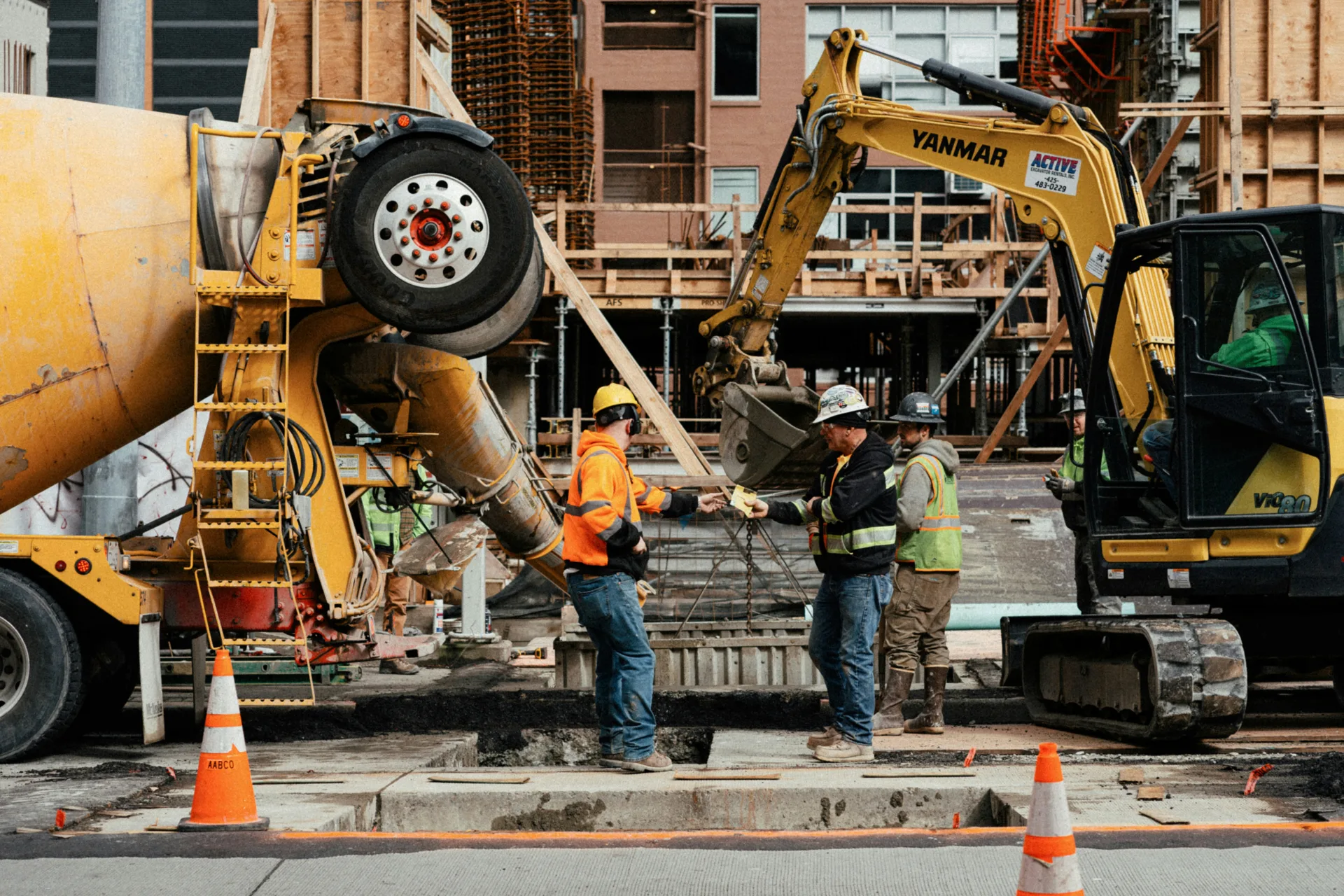 ready mix concrete pour on a Gatineau urban site with a mini excavator