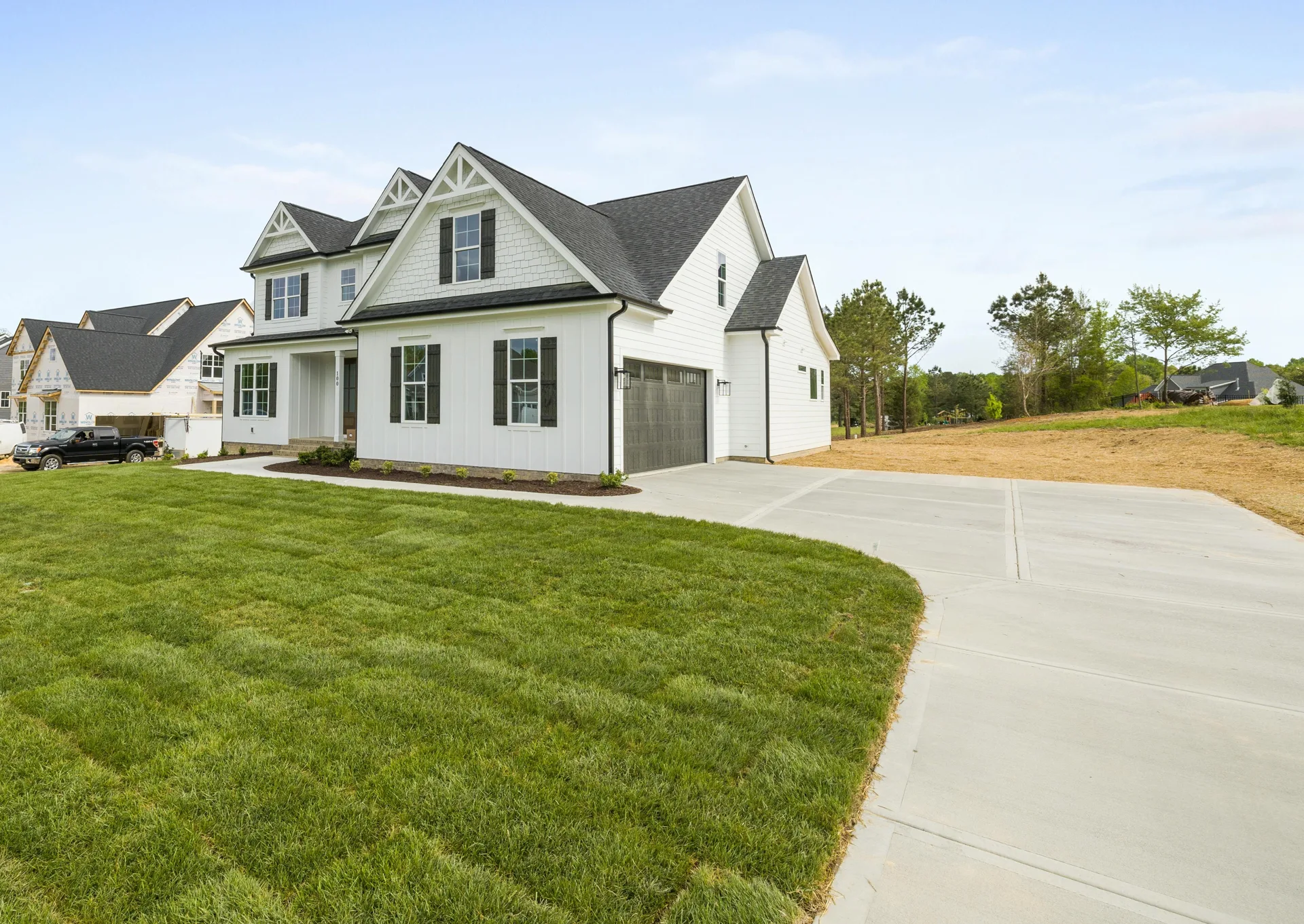 curving concrete driveway at an acreage home near Gatineau