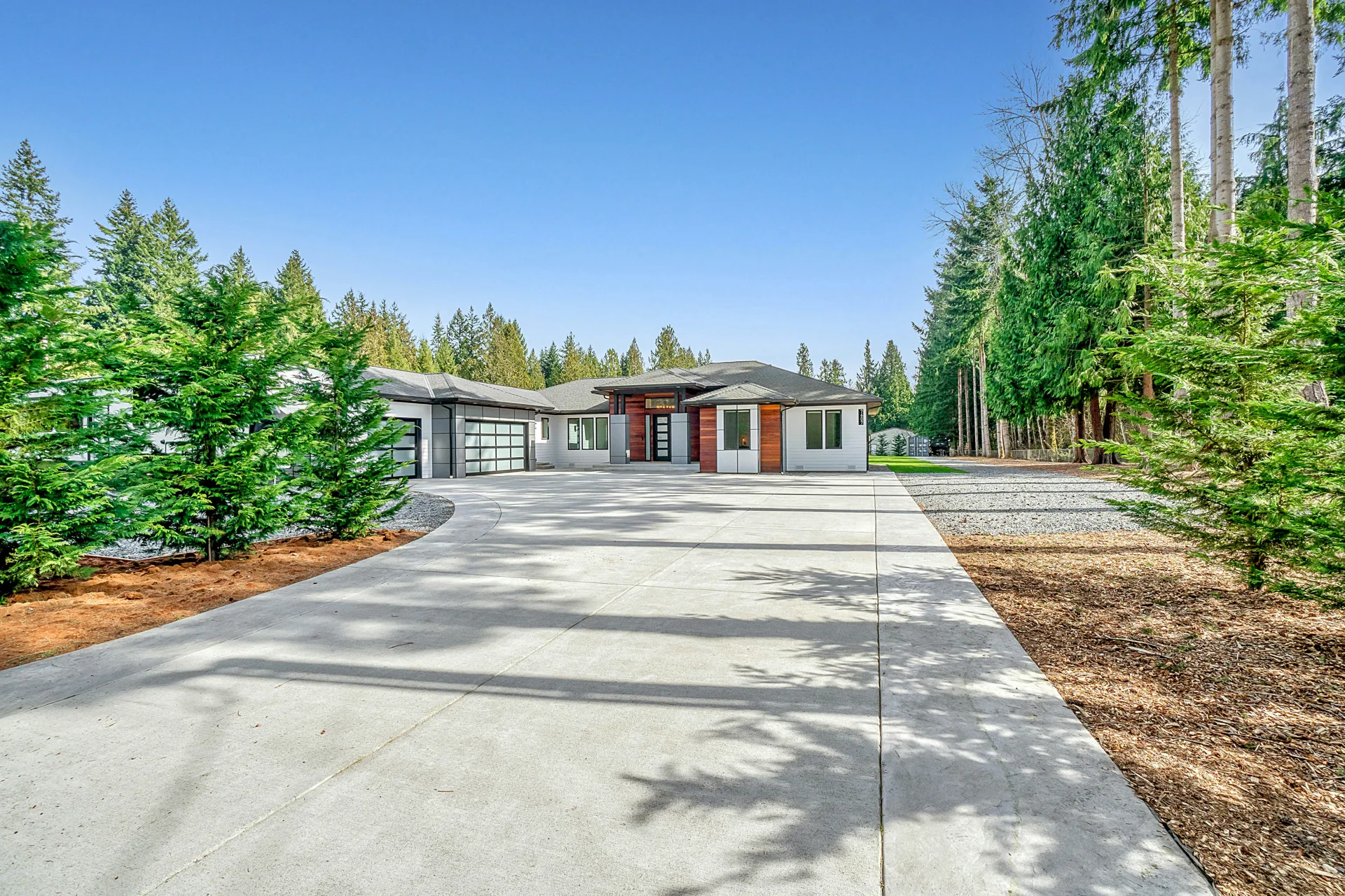 long coloured concrete driveway at a Gatineau home