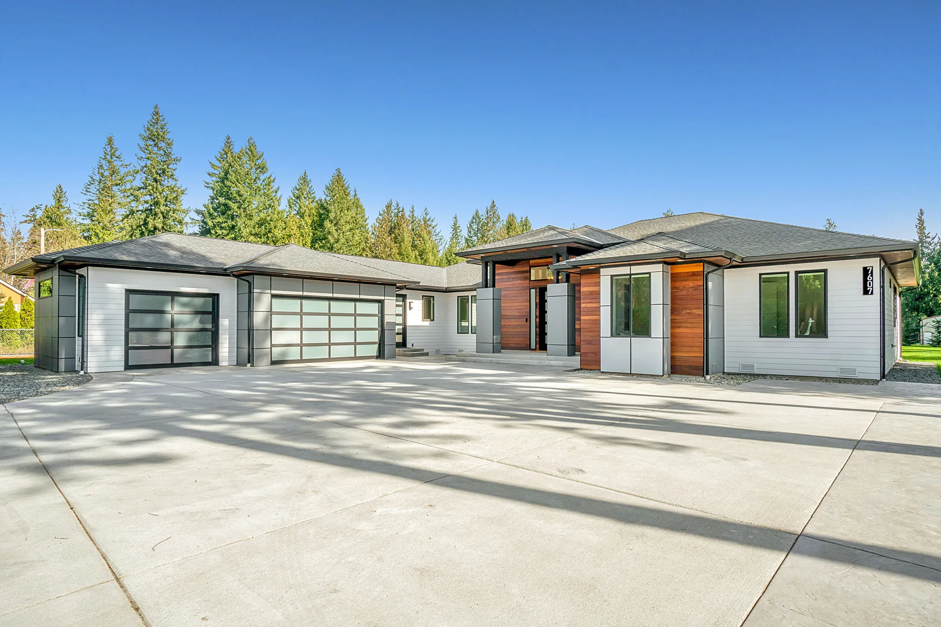 new concrete driveway at a modern three-car-garage Gatineau home