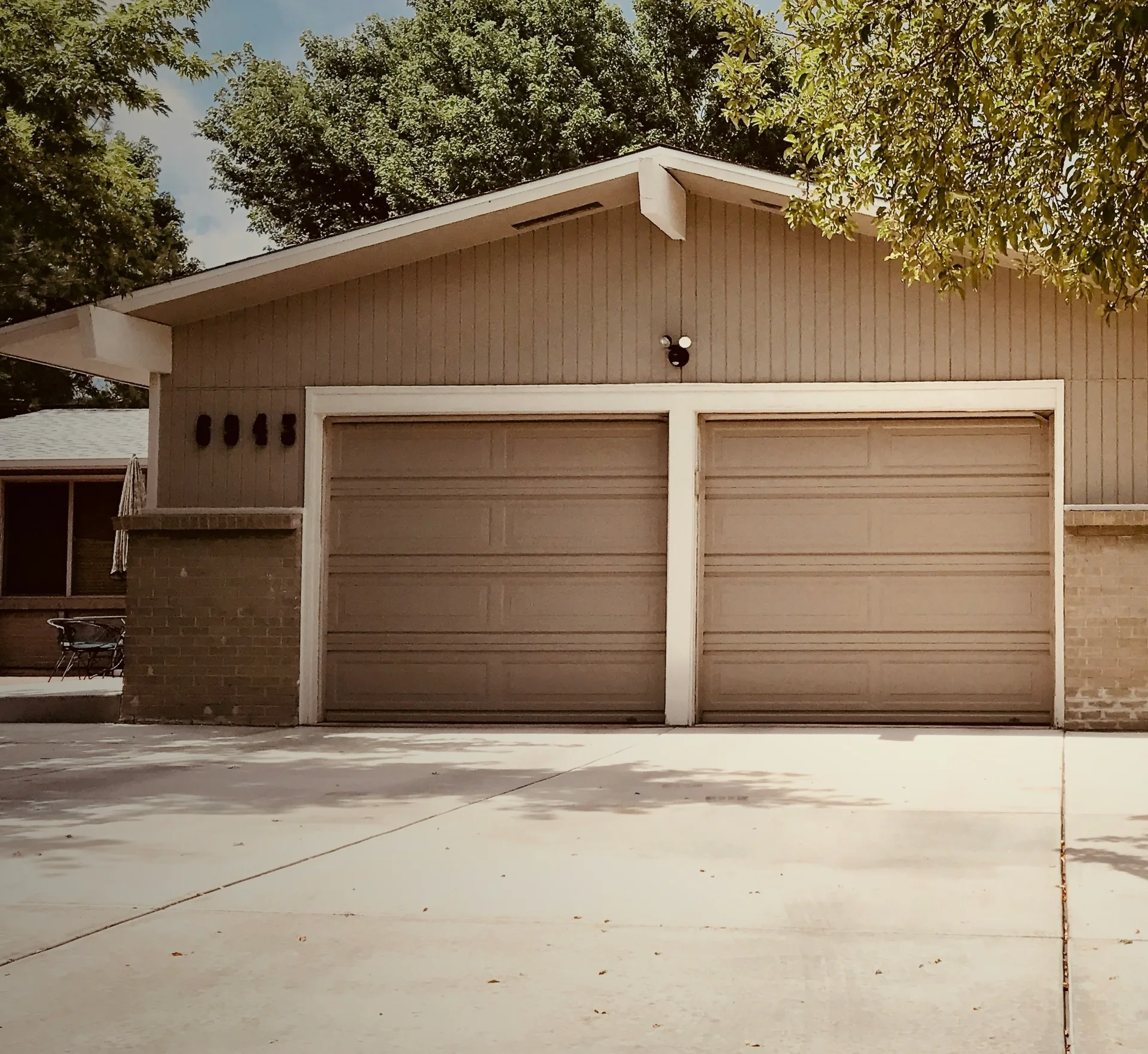 concrete driveway at a ranch home with a double garage in Gatineau