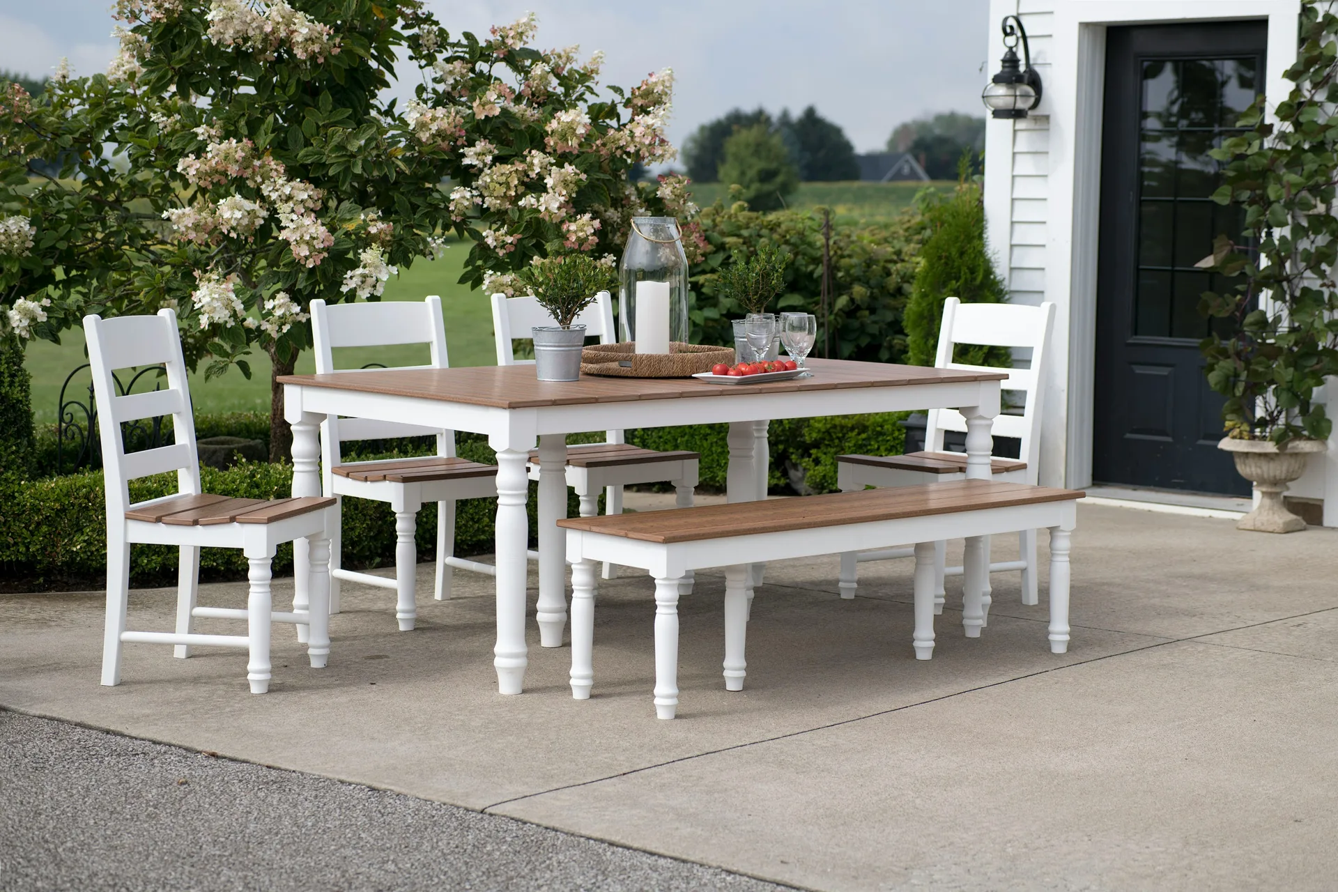 concrete patio with a dining table at a Gatineau farmhouse