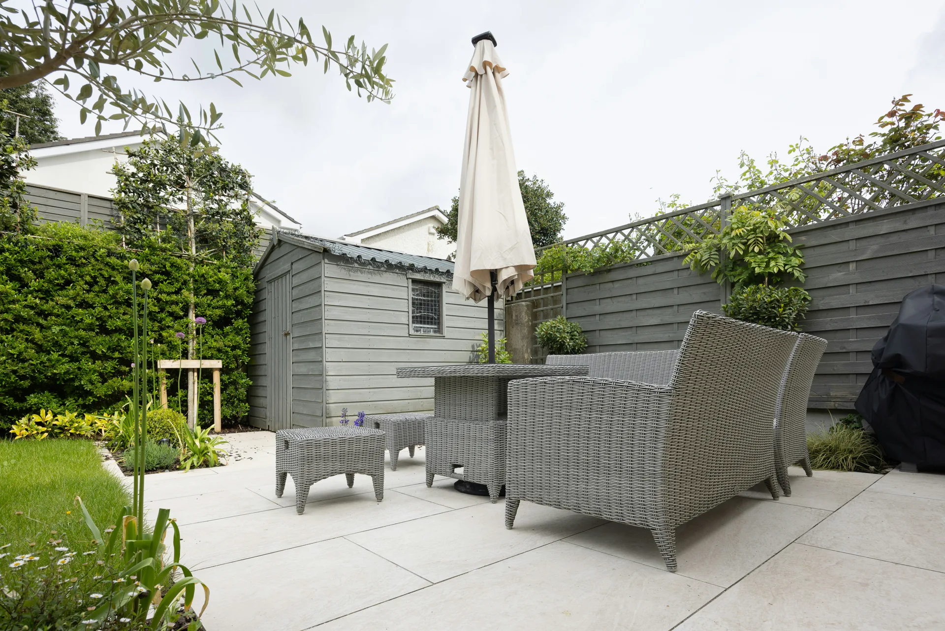 plain concrete patio in a Gatineau garden setting
