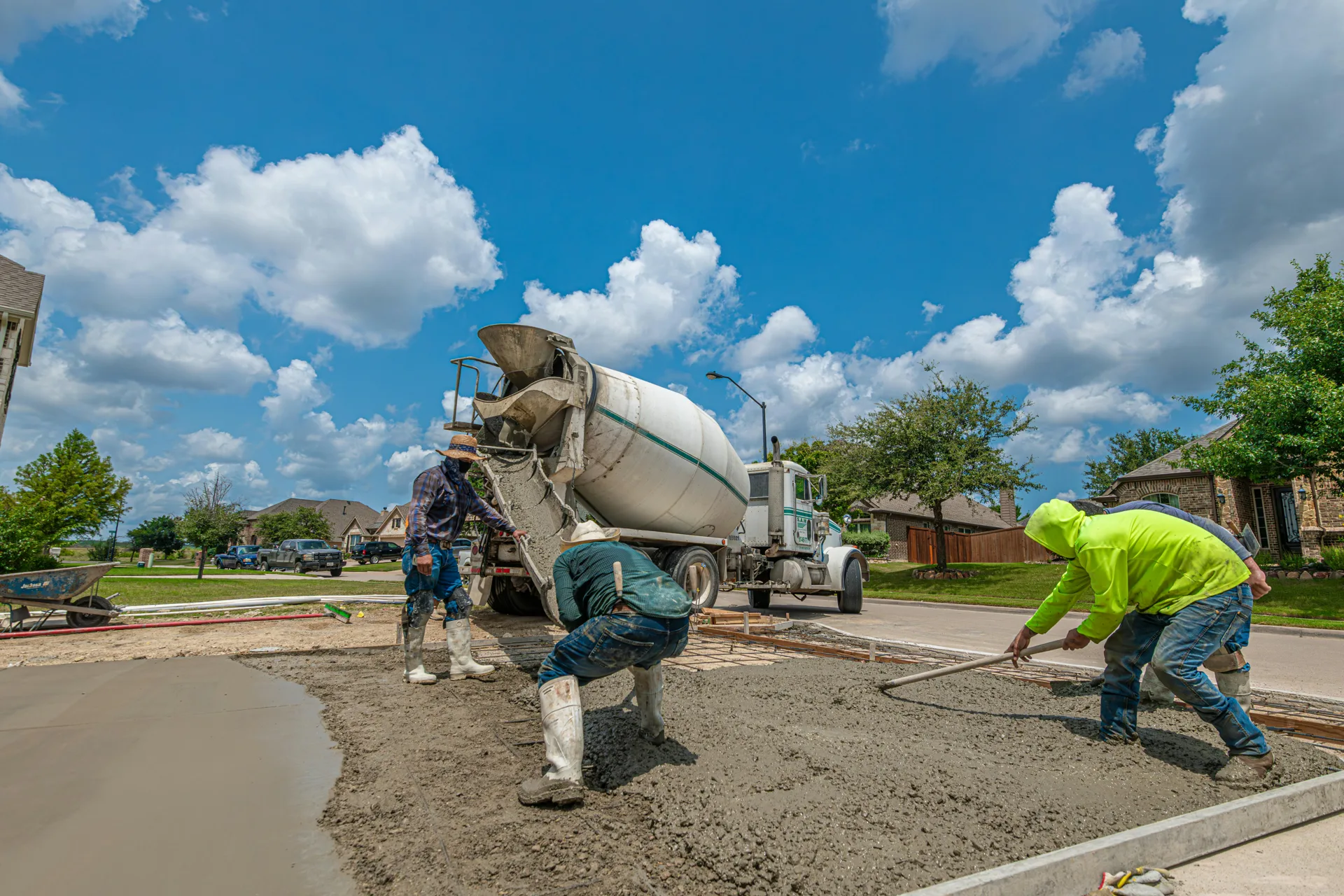 Gatineau concrete crew finishing a fresh driveway pour