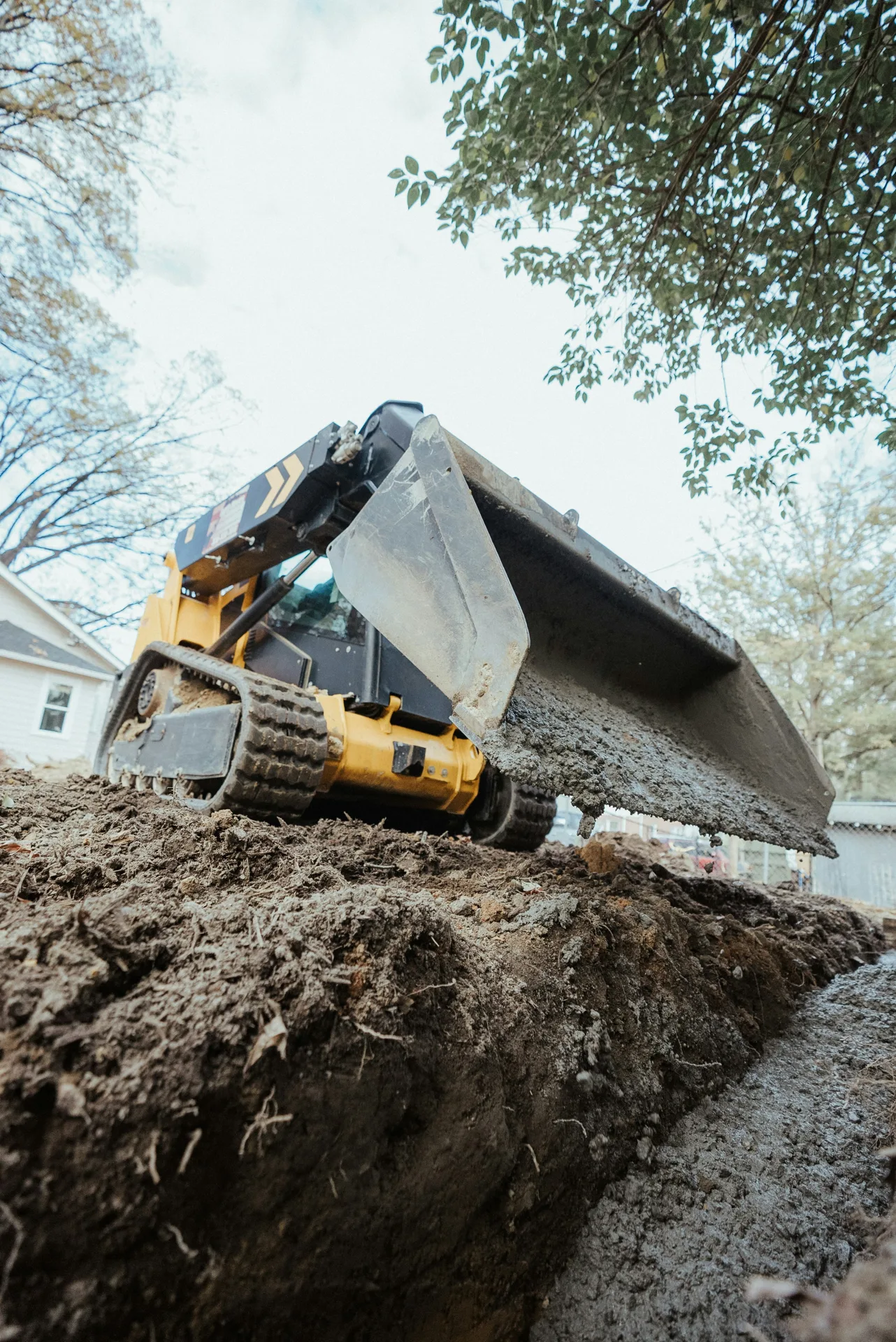 foundation repair pour with a track loader in Gatineau