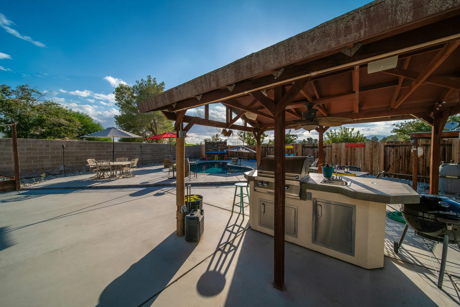 broom-finish concrete pad around a fire pit at a Gatineau home